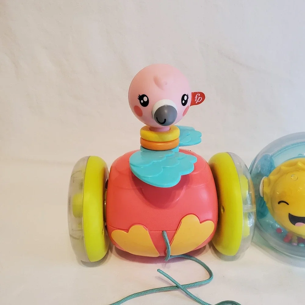 Fisher Price Paradise Pals Flamingo Roll A Round Rainbow Smile Face Pull Toys